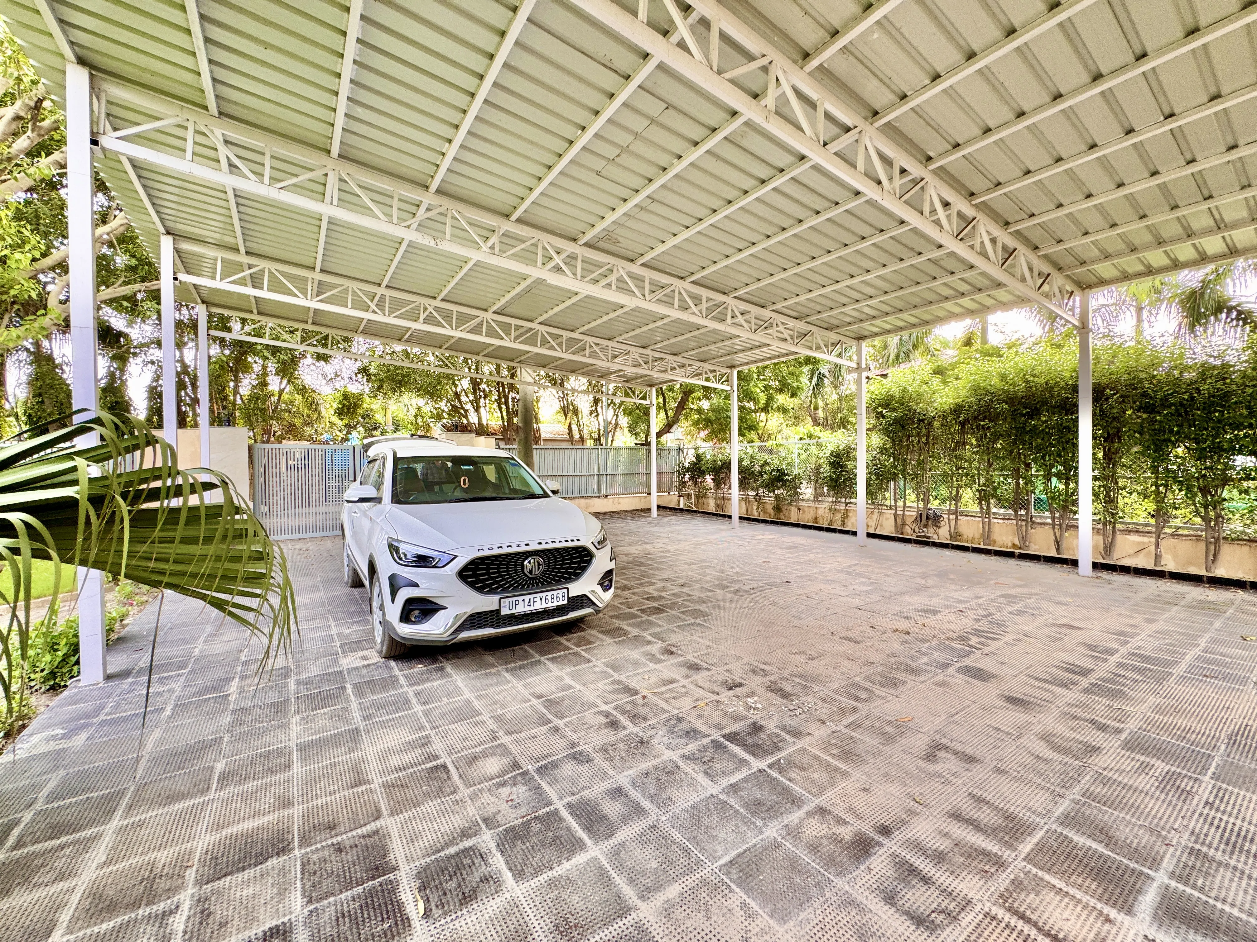 Covered car parking at Mulberry Farm, Sector 135 Noida, looking towards the lawn