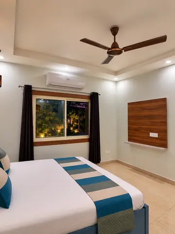 Double bed in bedroom one at Mulberry Farm farmhouse, Noida