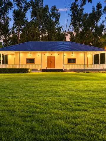 Front of the farmhouse at Mulberry Farm, Noida, lit at night