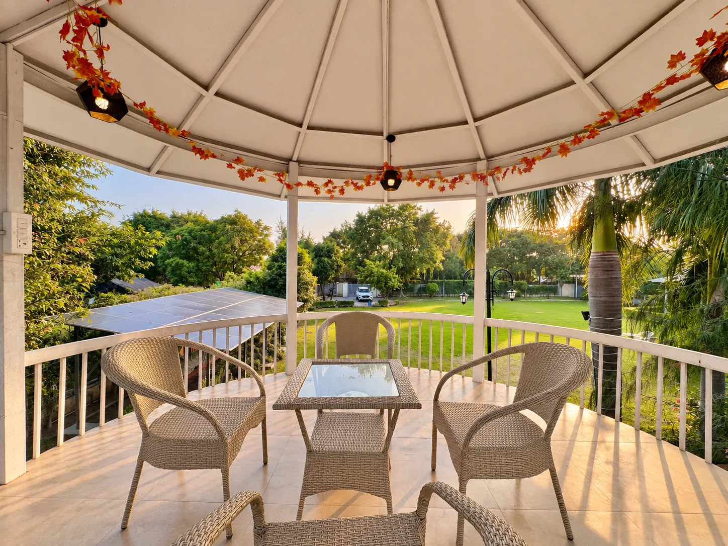 Two-level machan deck beside the swimming pool at Mulberry Farm, Noida